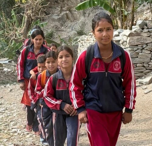 Girls in school uniforms walking in a line